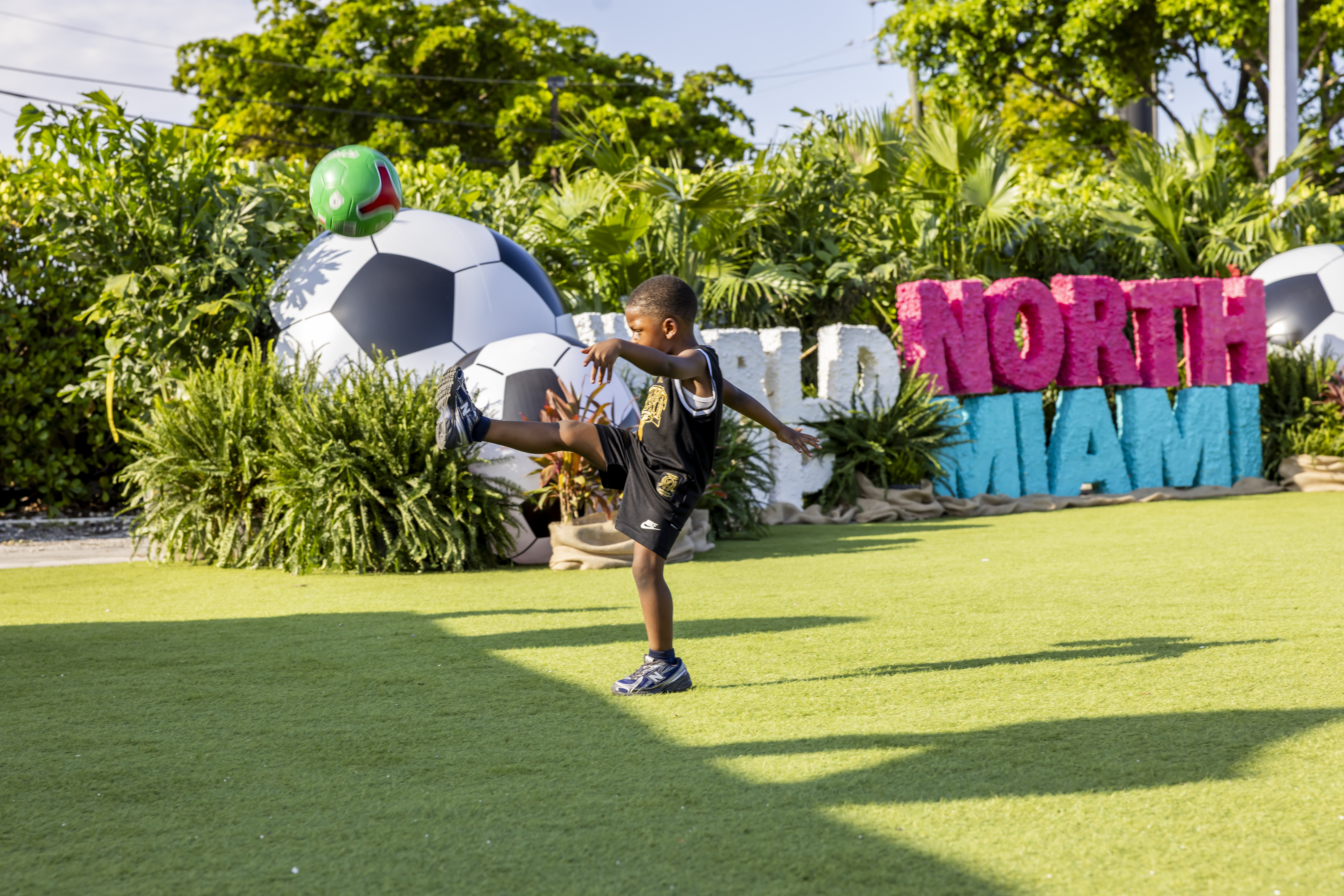 Kid kicking soccer ball